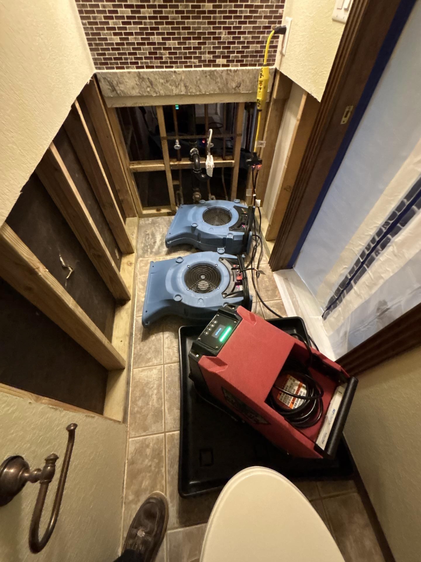 Bathroom structural drying — 2 air movers and 1 dehumidifier set after demo, Bakersfield CA